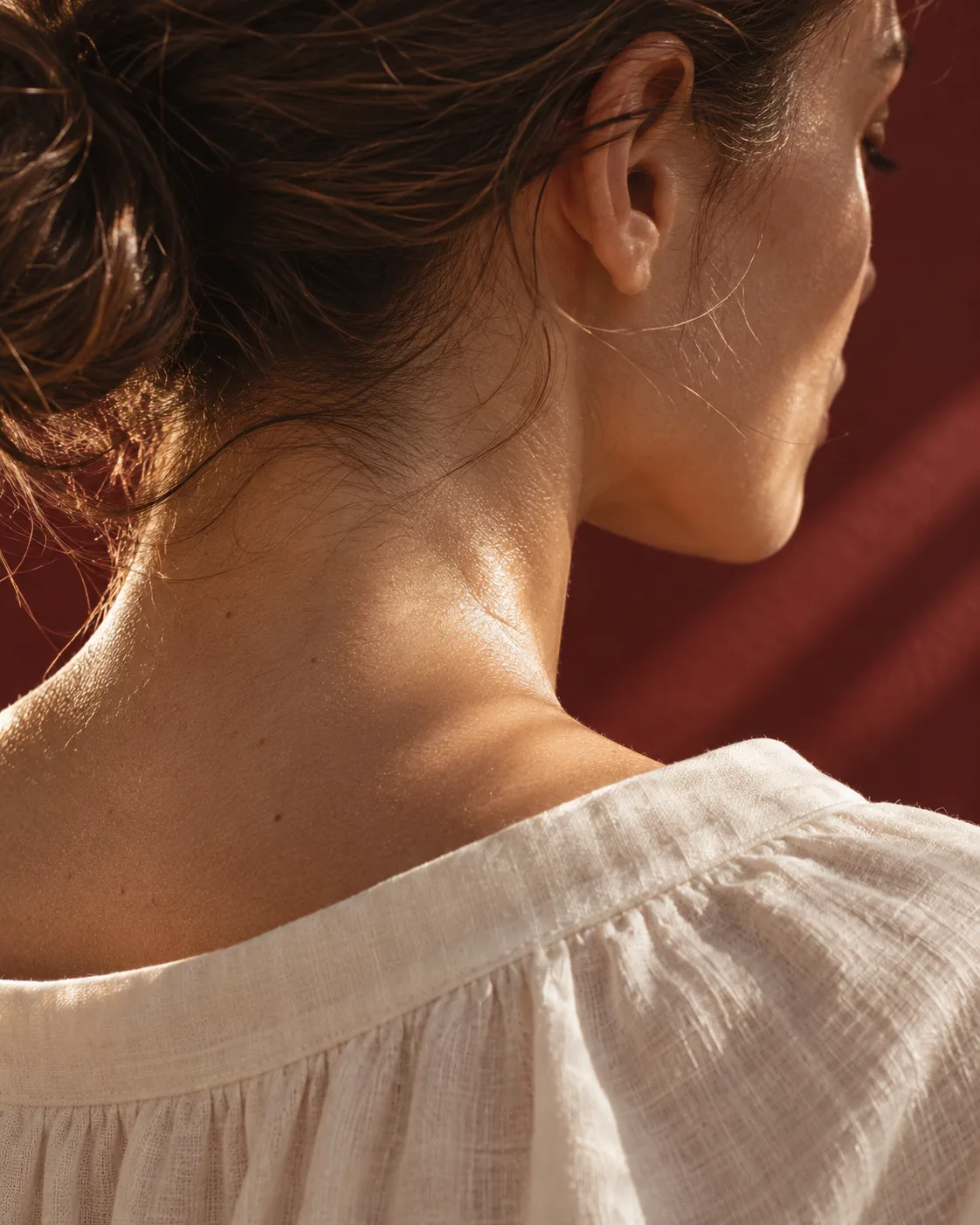 Natural skin texture on the back of the neck in warm light